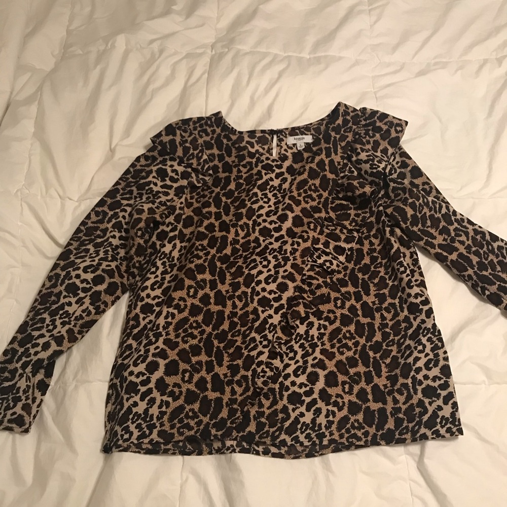 Leopard print long sleeve blouse with ruffles.